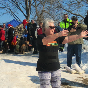 Canoe FM's Laura Richmond getting applauded by the crowd at the Lion's Polar Bear Challenge 2017